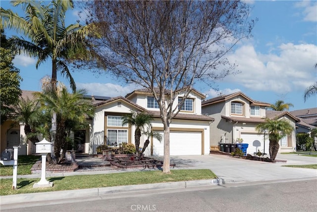 traditional home featuring concrete driveway, an attached garage, roof mounted solar panels, and stucco siding