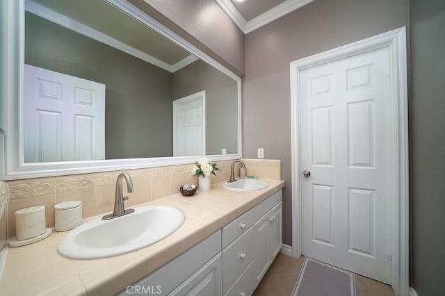 bathroom featuring double vanity, backsplash, a sink, and crown molding