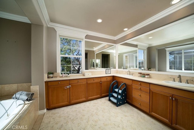 bathroom featuring ornamental molding, a sink, a bath, and double vanity