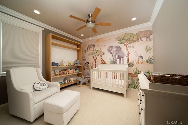 bedroom with recessed lighting, carpet floors, a ceiling fan, ornamental molding, and a nursery area