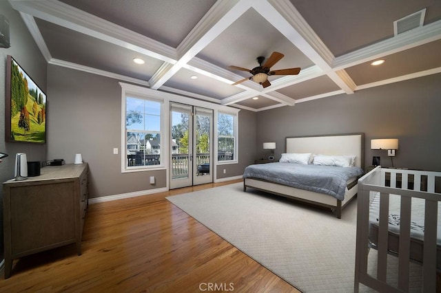 bedroom featuring coffered ceiling, wood finished floors, visible vents, baseboards, and access to outside