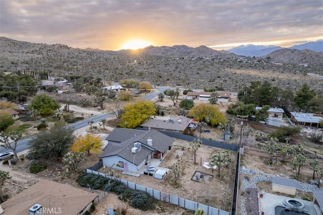 aerial view at dusk featuring a mountain view