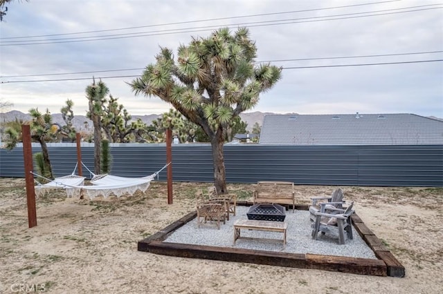 view of yard with a patio and a fire pit