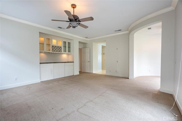 unfurnished living room with visible vents, light carpet, and baseboards