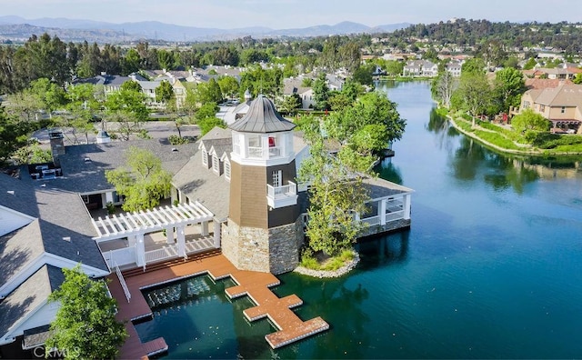 aerial view featuring a residential view and a water and mountain view