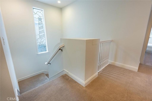 staircase featuring carpet floors, recessed lighting, and baseboards