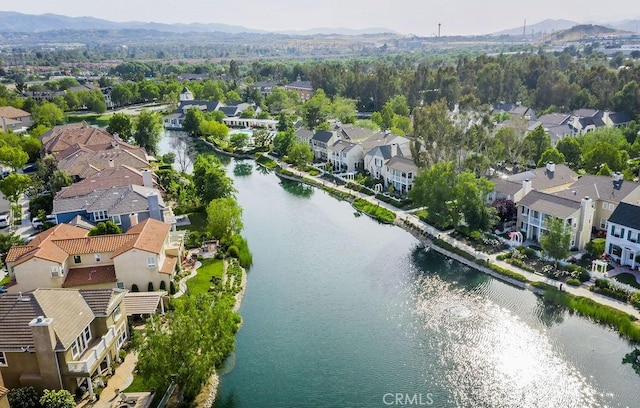 bird's eye view with a water and mountain view and a residential view