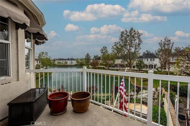 balcony featuring a water view