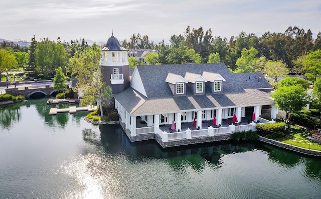 birds eye view of property with a water view