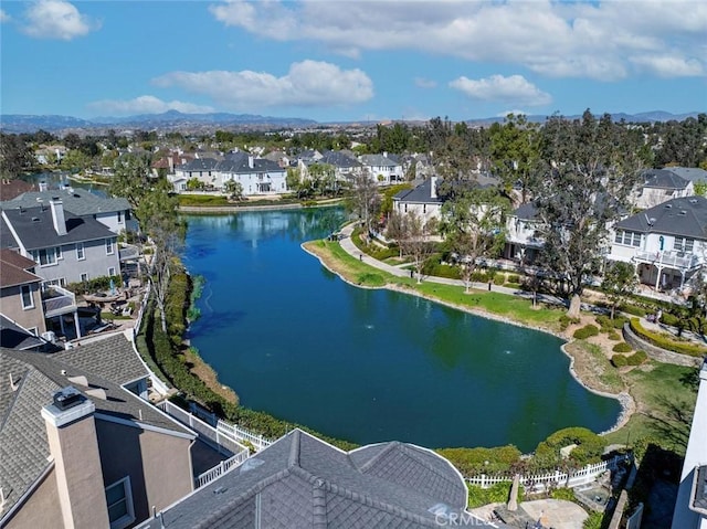 birds eye view of property featuring a water view and a residential view