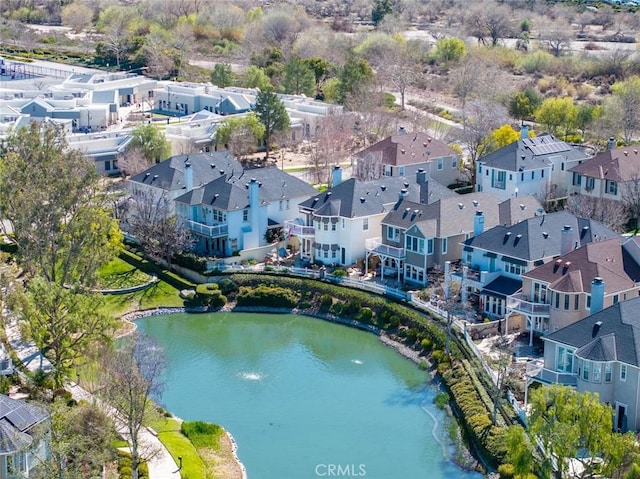 bird's eye view with a water view and a residential view