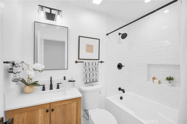 bathroom with toilet, bathing tub / shower combination, and vanity