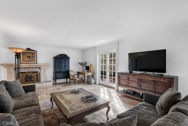 living room featuring crown molding, a high end fireplace, stone finish flooring, and french doors