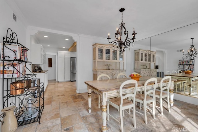 dining space featuring visible vents, crown molding, stone tile flooring, an inviting chandelier, and recessed lighting