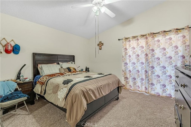 bedroom featuring vaulted ceiling, carpet floors, a textured ceiling, and a ceiling fan