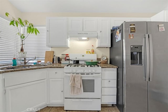 kitchen with white cabinetry, a sink, white range with gas cooktop, under cabinet range hood, and stainless steel fridge with ice dispenser