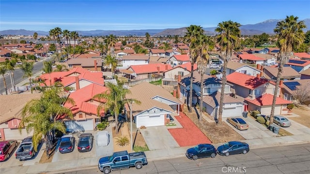 aerial view featuring a mountain view and a residential view