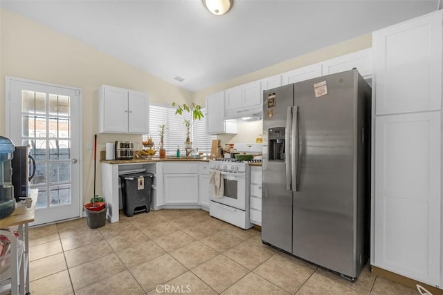 kitchen featuring lofted ceiling, under cabinet range hood, white cabinets, white range with gas cooktop, and stainless steel refrigerator with ice dispenser