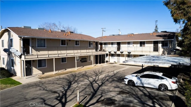 rear view of property with stucco siding