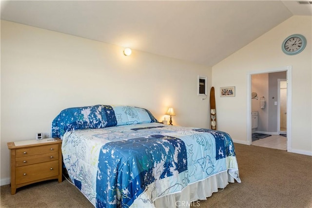 carpeted bedroom with lofted ceiling and baseboards