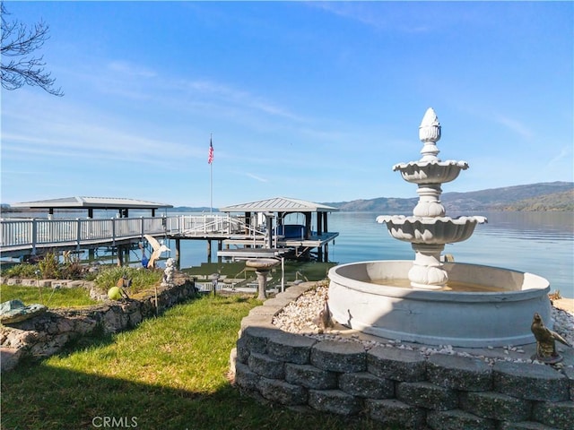 dock area with a water and mountain view