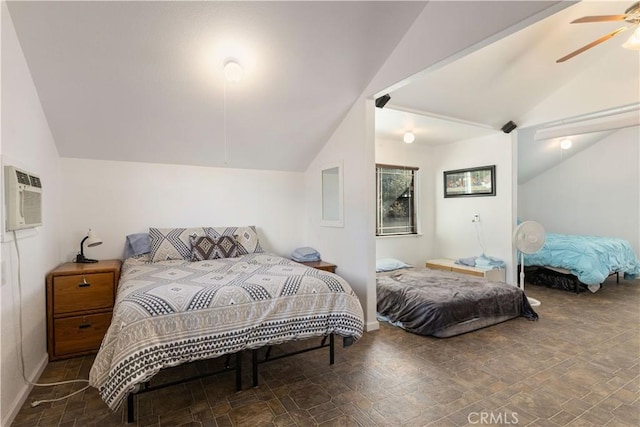 bedroom featuring ceiling fan, vaulted ceiling, and a wall mounted AC