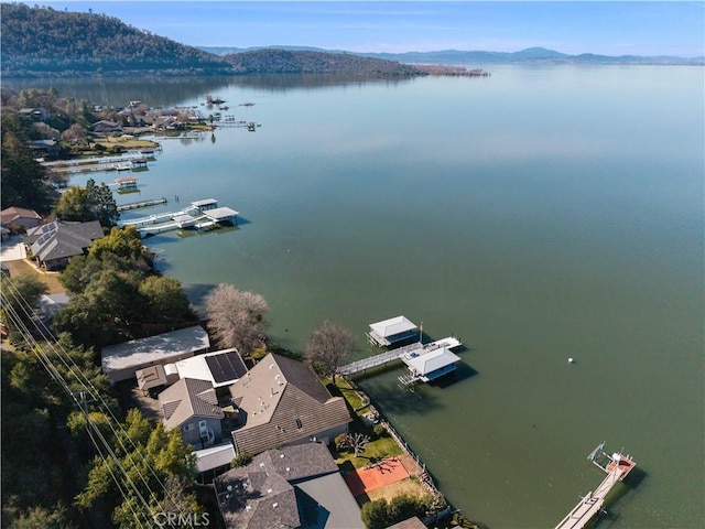 bird's eye view featuring a water and mountain view