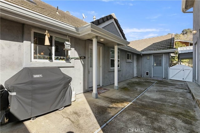 view of patio / terrace featuring a gate and grilling area