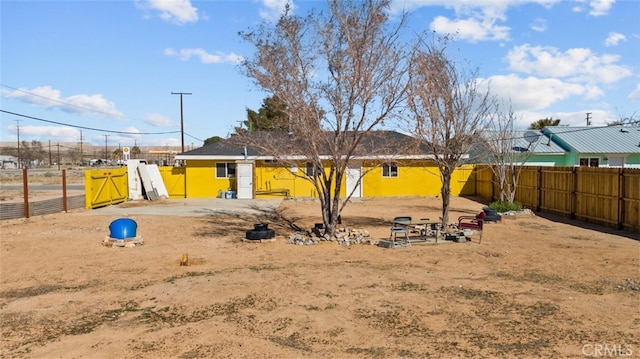 back of property with fence