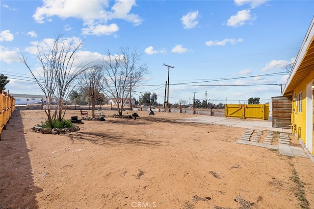 view of yard with fence and a gate