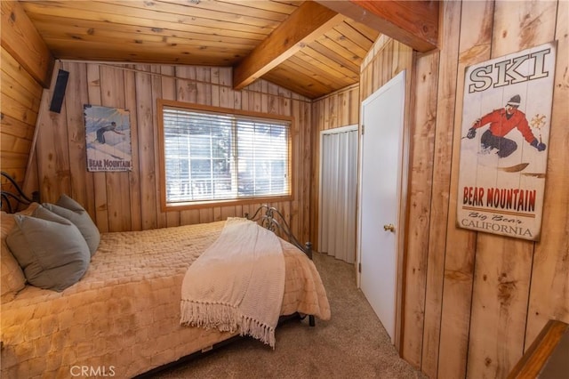 carpeted bedroom featuring wooden ceiling, wood walls, and vaulted ceiling with beams