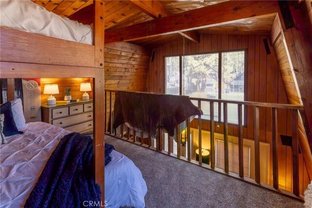 bedroom with vaulted ceiling with beams, wooden ceiling, wooden walls, and carpet flooring