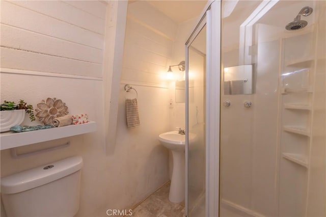 full bath with a stall shower and toilet