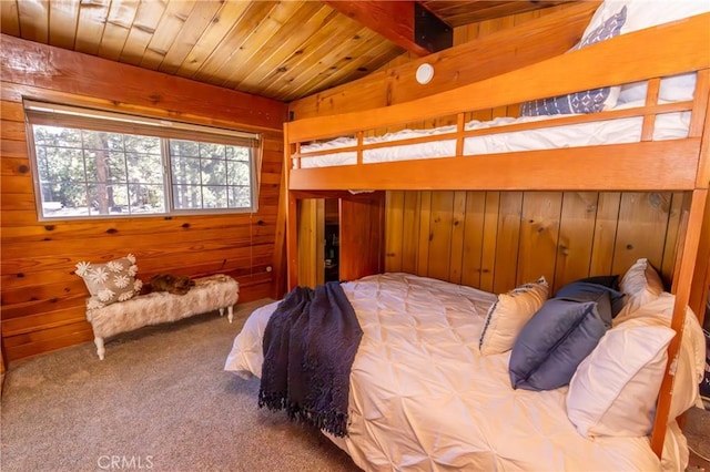 carpeted bedroom featuring vaulted ceiling with beams, wood ceiling, and wooden walls