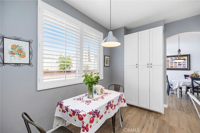 dining area featuring light wood-type flooring