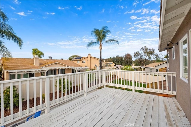 wooden deck with a residential view