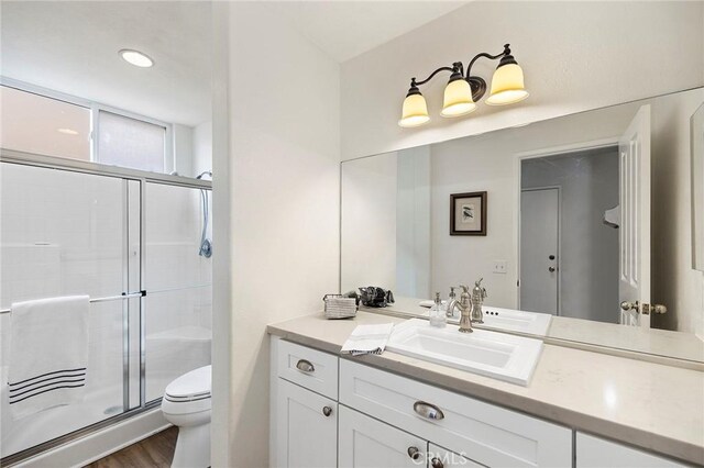 32388 Corte Palacio, Temecula, CA 92592 - full bath featuring a stall shower, vanity, toilet, and wood finished floors