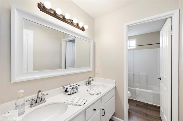 32388 Corte Palacio, Temecula, CA 92592 - bathroom with toilet, double vanity, wood finished floors, and washtub / shower combination