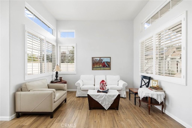 sitting room with light wood-style floors and baseboards