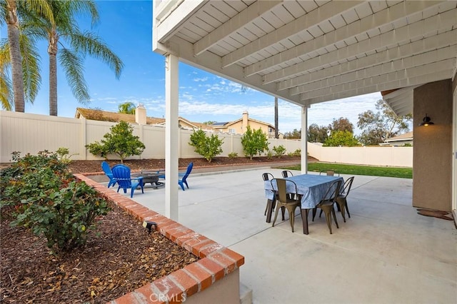 view of patio with a fenced backyard and outdoor dining area