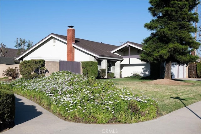 single story home with a front yard and a chimney