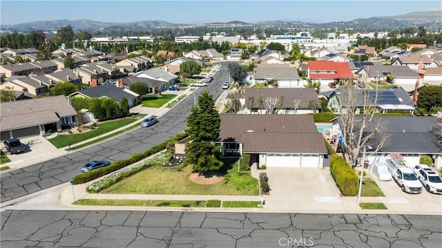 drone / aerial view with a mountain view and a residential view