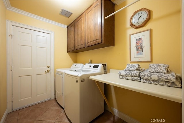 washroom featuring crown molding, cabinet space, visible vents, light tile patterned flooring, and separate washer and dryer