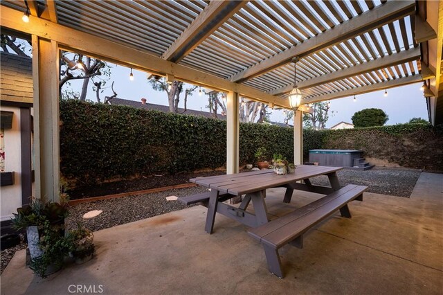 view of patio featuring outdoor dining area, a fenced backyard, a pergola, and a hot tub