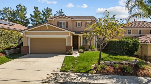 craftsman inspired home with a garage, driveway, a front lawn, and brick siding