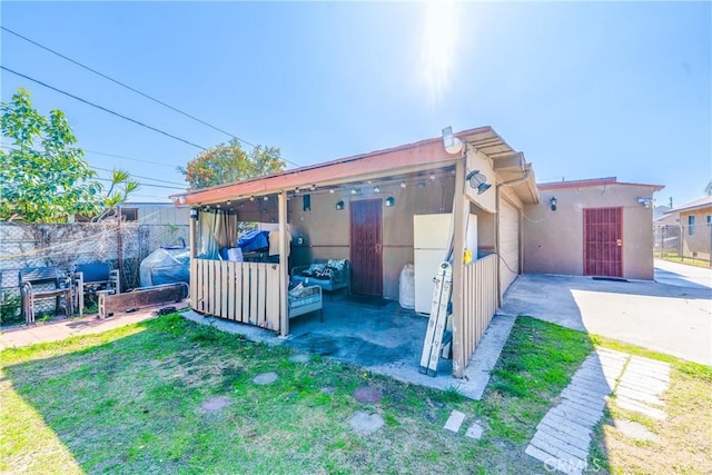 view of outbuilding with fence