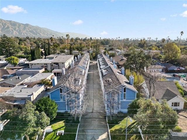 drone / aerial view with a residential view and a mountain view