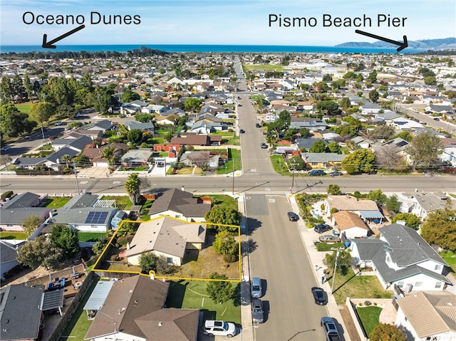 bird's eye view with a residential view and a water view