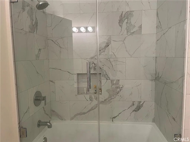 bathroom with enclosed tub / shower combo