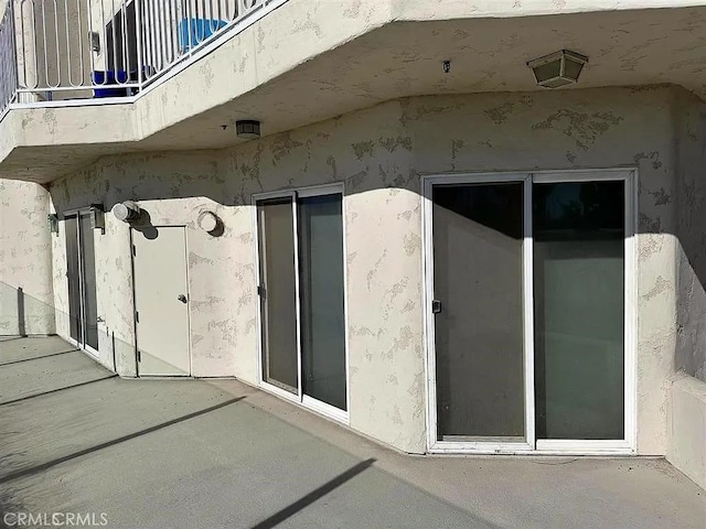 25 15th Pl Unit 101, Long Beach, CA 90802 - view of home's exterior featuring a patio and stucco siding